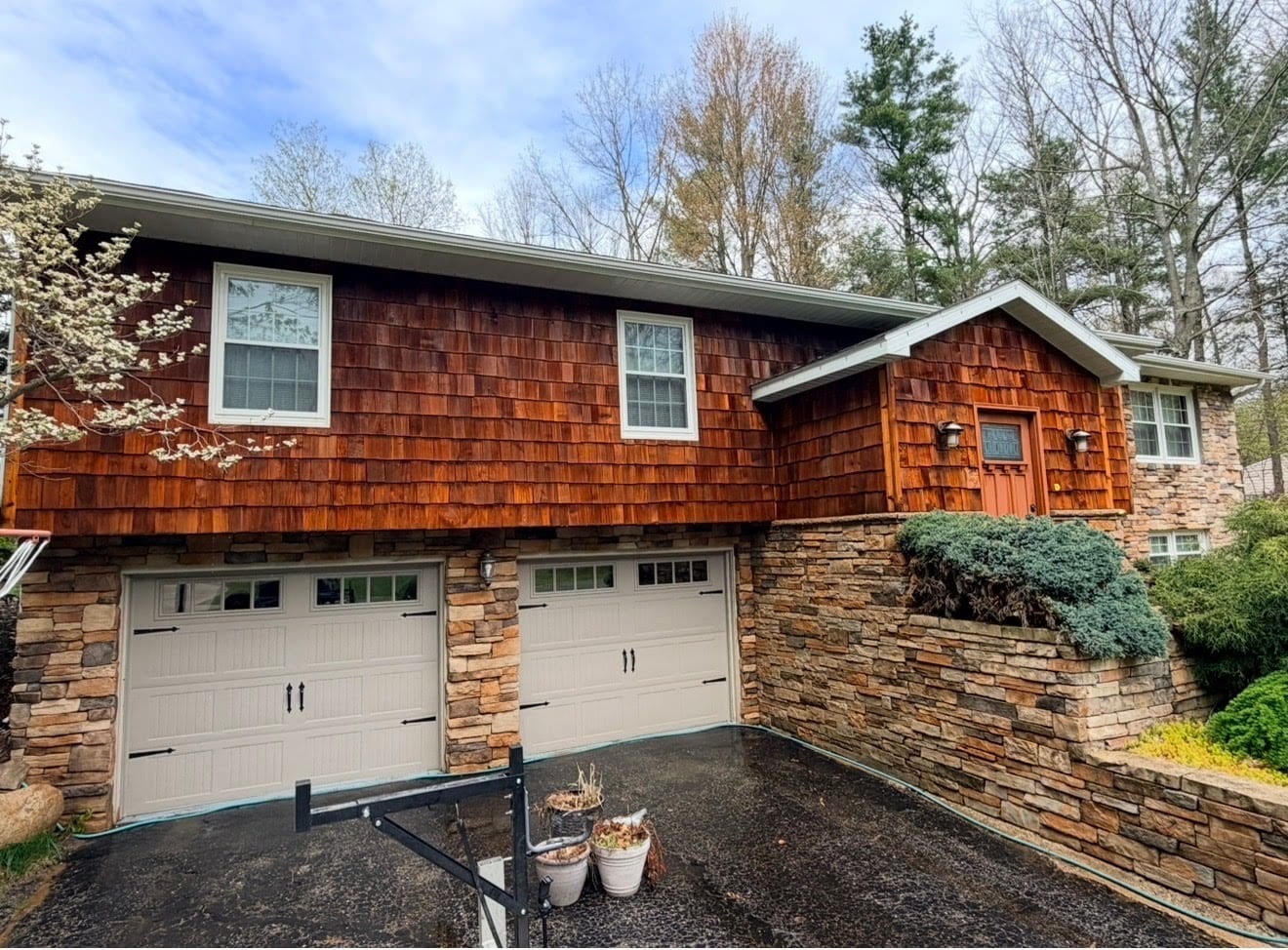 Cedar shake siding after soft washing — rich warm wood tones restored