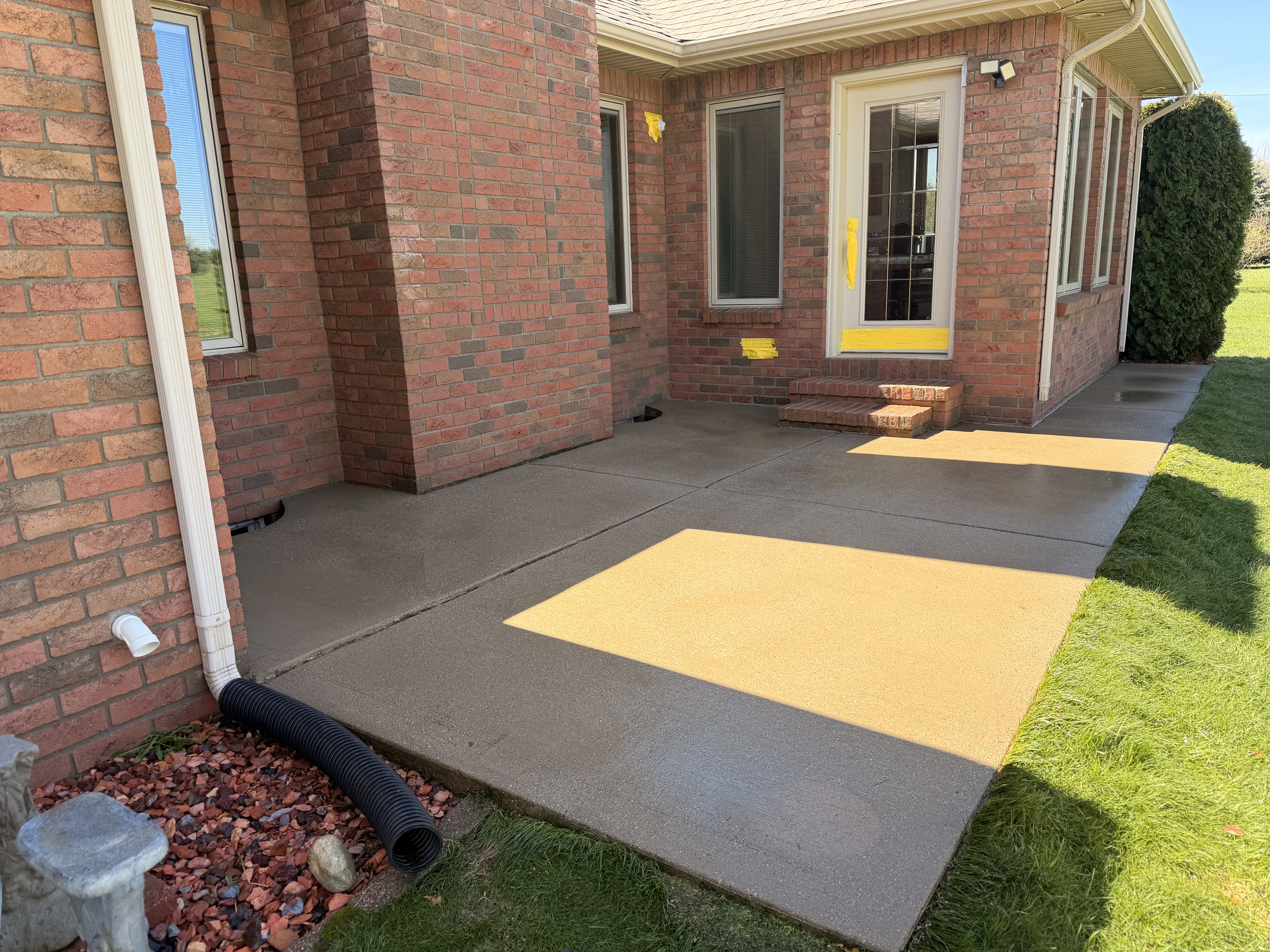 Concrete surface before pressure washing — oil and grime