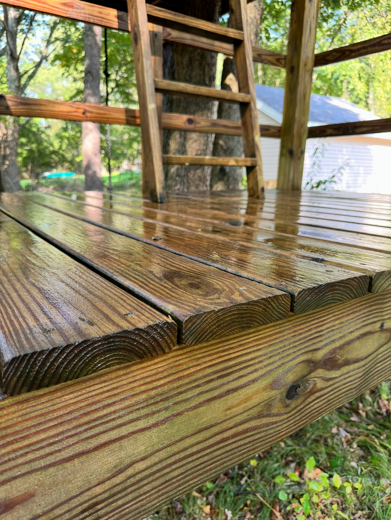 Wooden deck before pressure washing — weathered and gray