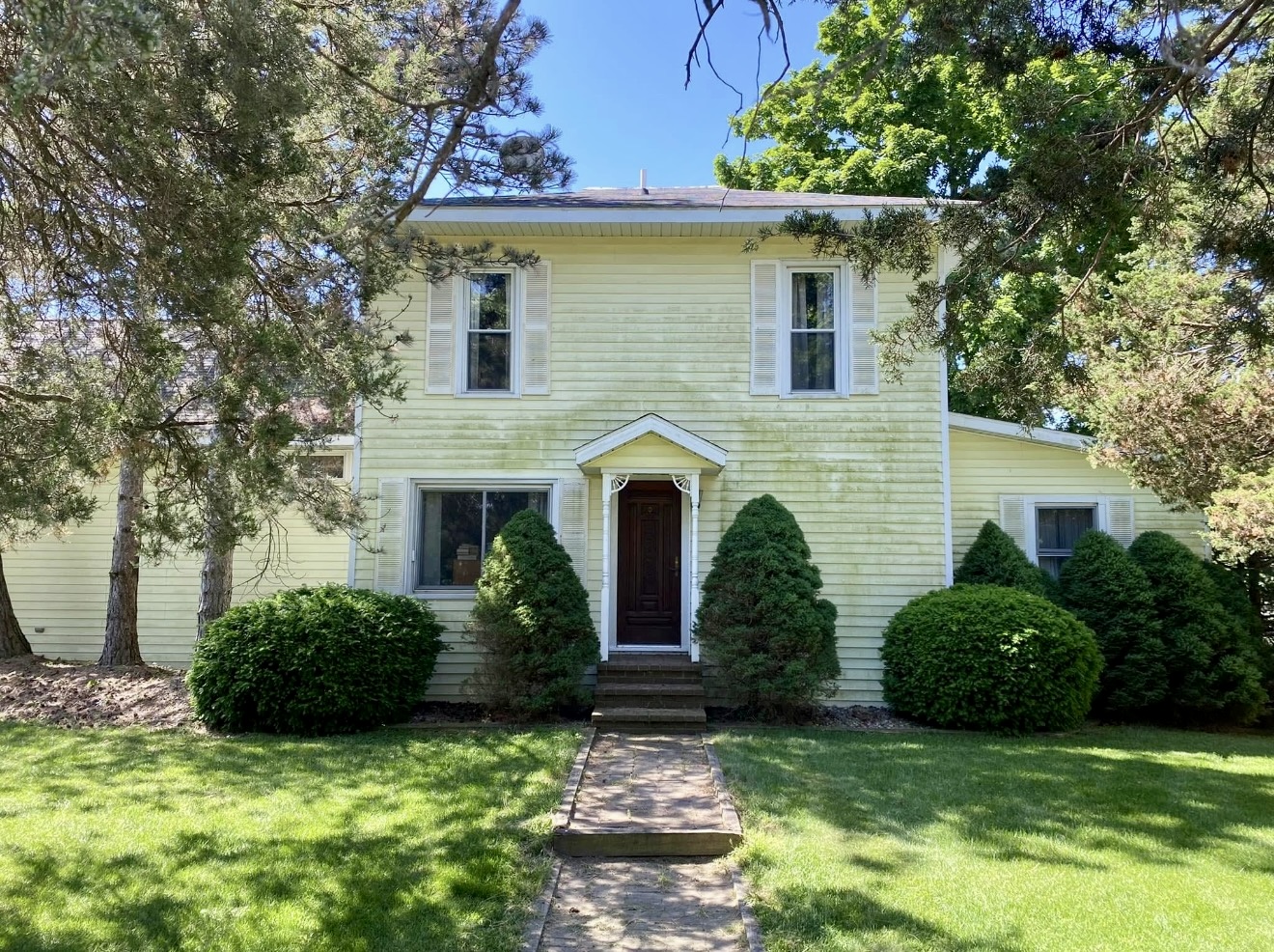 Home exterior after pressure washing — clean and restored