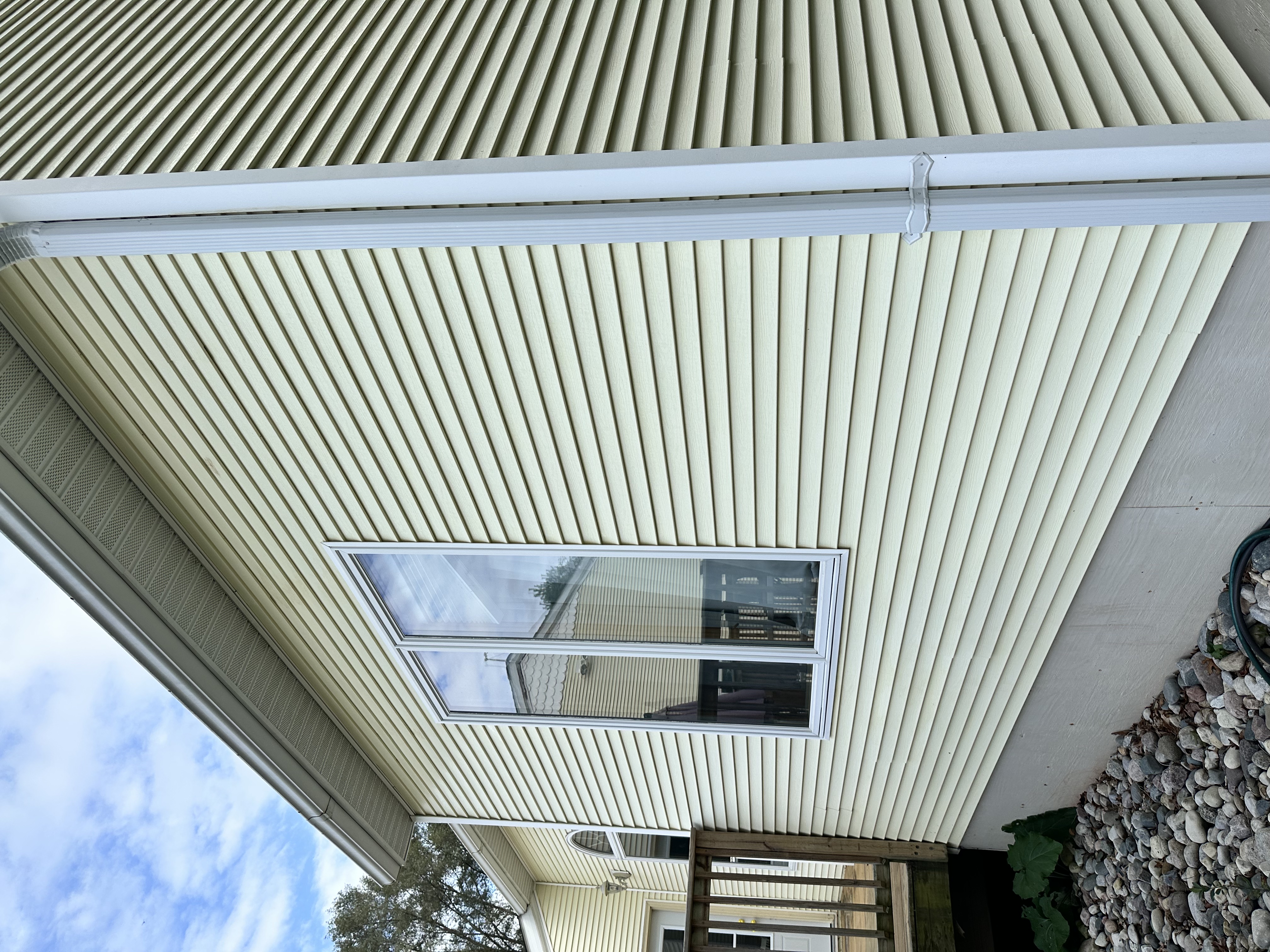 House siding before soft washing — algae and grime buildup