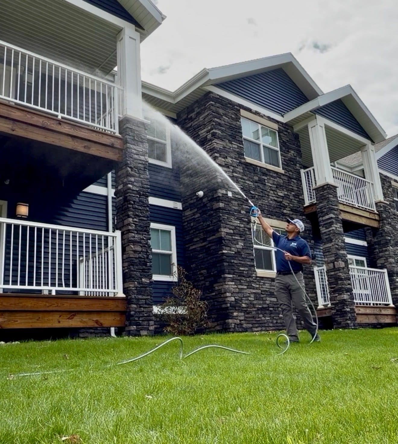 Soft washing a multi-unit residential building — Rapid River Pro Wash commercial service